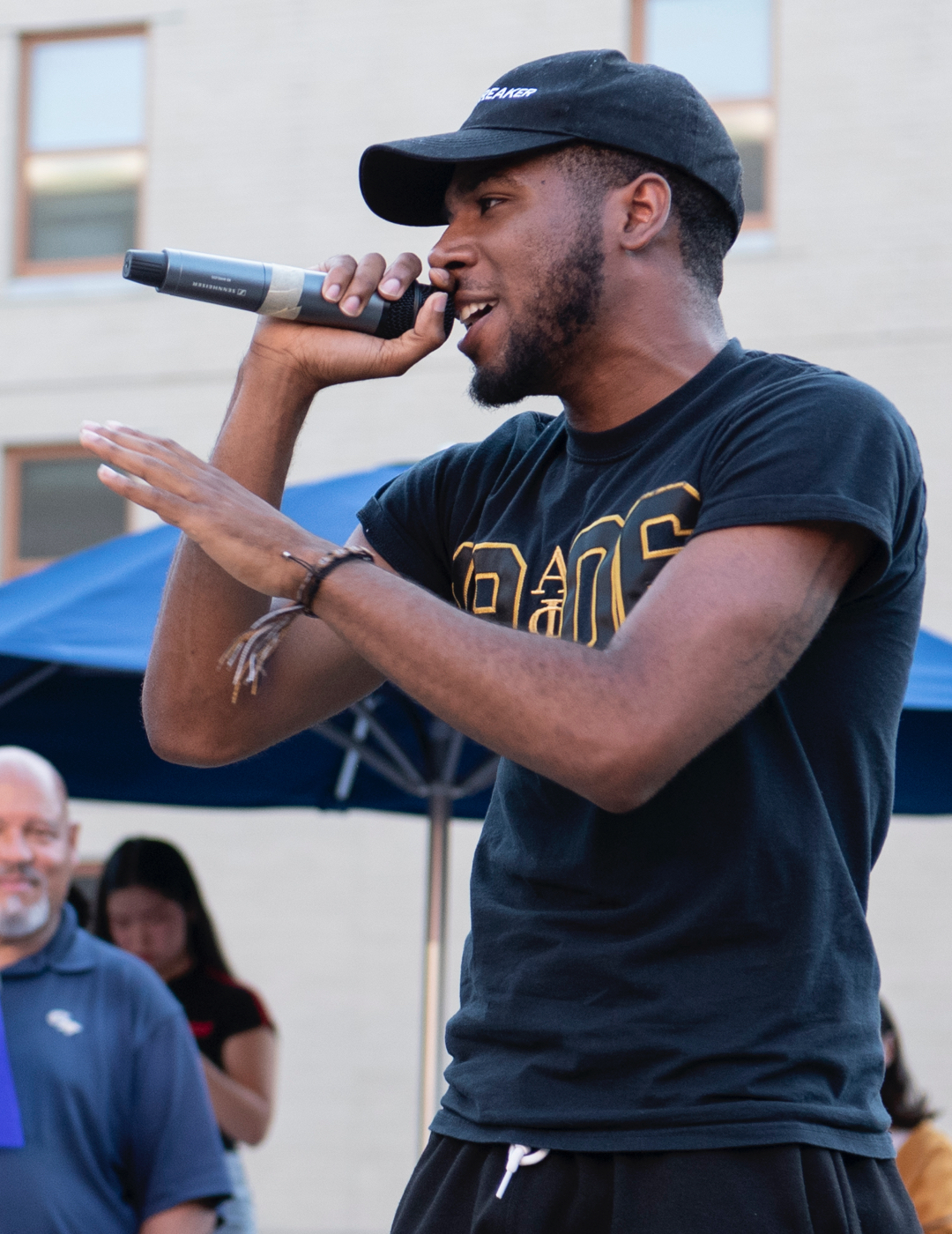 student speaking at block party