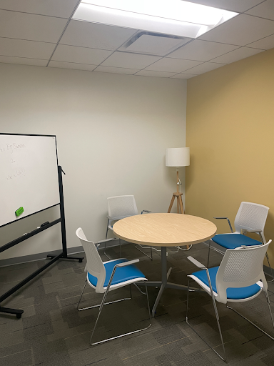 Private study room with 4 chairs, 1 table, and a mobile whiteboard
