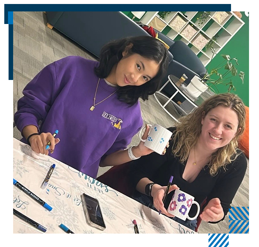 Students decorating mugs at a MSSC program